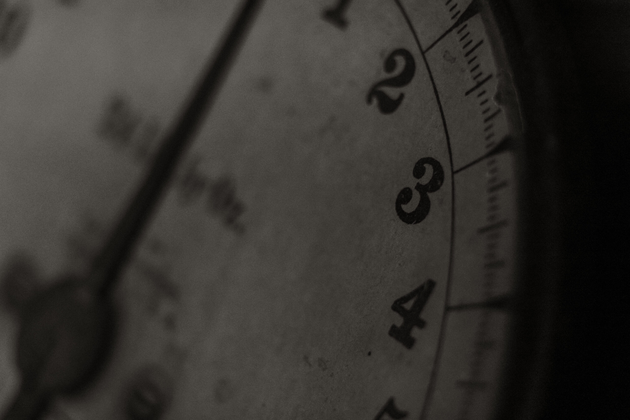 Antique rustic metal kitchen scale in close-up black and white