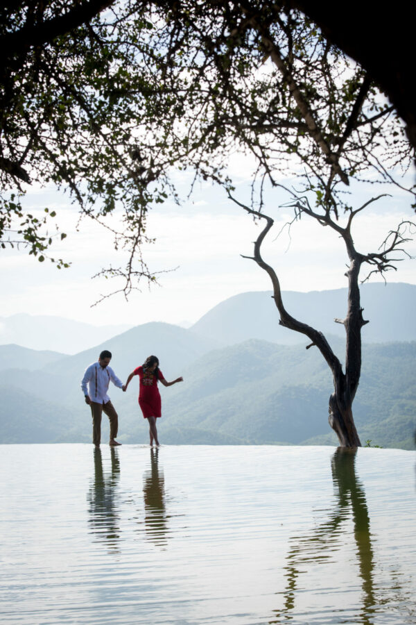 Couple wading in the Hierve el Agua infinity pools, Oaxaca